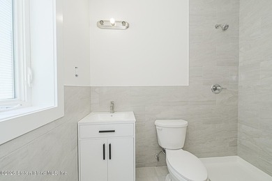 An exceptional new construction 6/6 two-family home offering 2 - photo 19