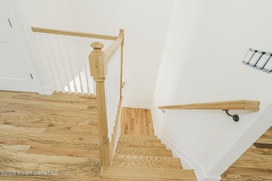 An exceptional new construction 6/6 two-family home offering 2 - photo 22