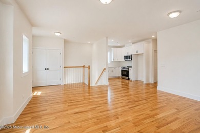 An exceptional new construction 6/6 two-family home offering 2 - photo 24