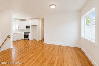 An exceptional new construction 6/6 two-family home offering 2 - photo 26