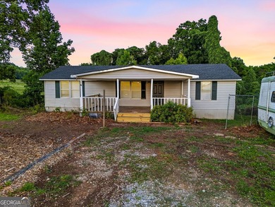 Opportunity awaits in North Hall! Situated on over an acre in - photo 1