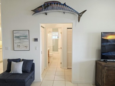 Elevated Coastal Living in Breezeswept Beach Estates. Skip the - photo 18