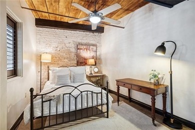 This charming, custom-designed two-bedroom condo at the historic