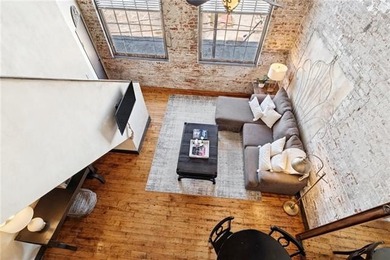 This charming, custom-designed two-bedroom condo at the historic