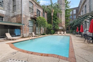 This charming, custom-designed two-bedroom condo at the historic