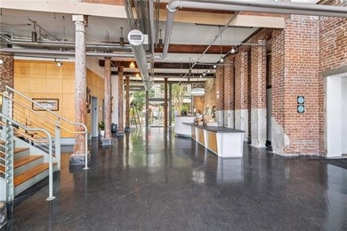 This charming, custom-designed two-bedroom condo at the historic