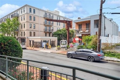 This charming, custom-designed two-bedroom condo at the historic