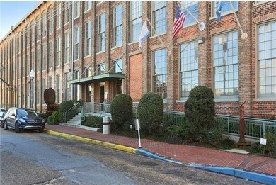 This charming, custom-designed two-bedroom condo at the historic