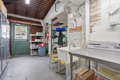 Set on 395 expansive acres, this rare offering features a fully - photo 32