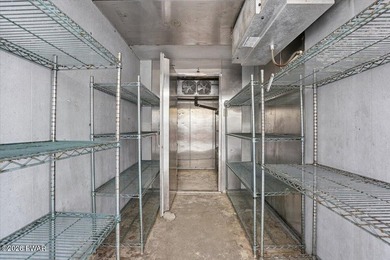 Set on 395 expansive acres, this rare offering features a fully - photo 35