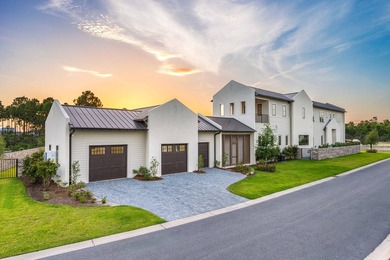 A showstopper of modern coastal elegance, 36 Sandcord Drive is a - photo 3
