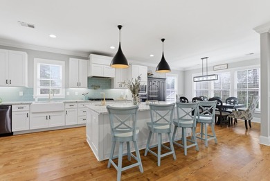 Experience elevated Low-country living at 613 Collins Creek