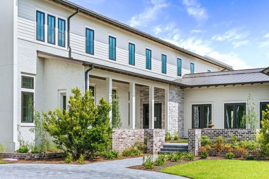 A showstopper of modern coastal elegance, 36 Sandcord Drive is a - photo 7
