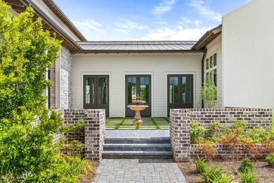 A showstopper of modern coastal elegance, 36 Sandcord Drive is a - photo 8