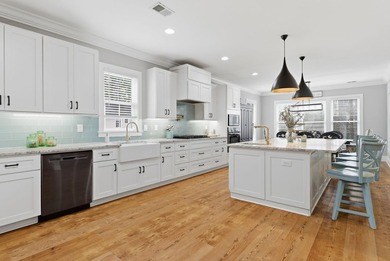 Experience elevated Low-country living at 613 Collins Creek