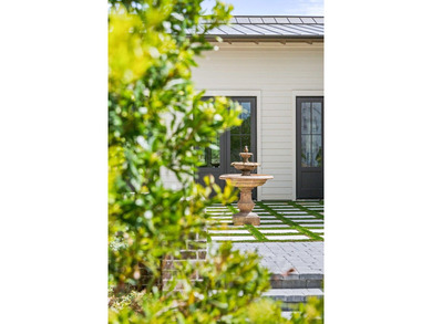 A showstopper of modern coastal elegance, 36 Sandcord Drive is a - photo 9