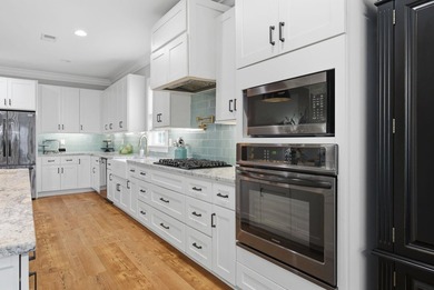 Experience elevated Low-country living at 613 Collins Creek