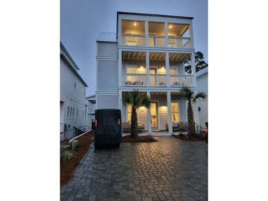 Stunning three-story beach home located less than half a mile - photo 1