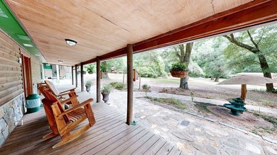 HUNTERS PARADISE in the country on 28-acres. This wooded estate