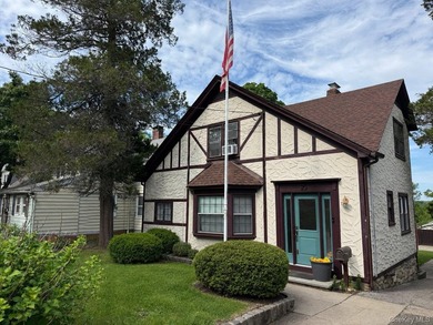 Picture-perfect 3-bedroom, 1.5-bath Tudor set on a tree-lined - photo 2
