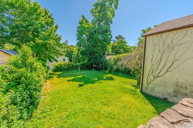 Picture-perfect 3-bedroom, 1.5-bath Tudor set on a tree-lined - photo 4