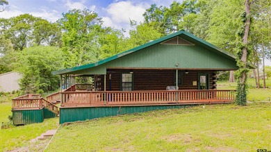 Adorable log cabin on beautiful Lake Winnsboro nestled in a - photo 3