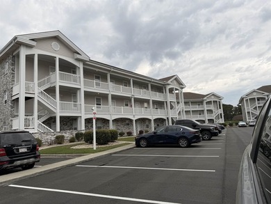 Welcome home to this golf course view condo located in the - photo 1
