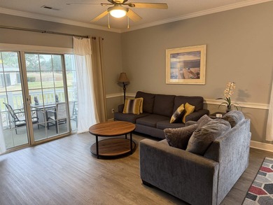 Welcome home to this golf course view condo located in the - photo 3