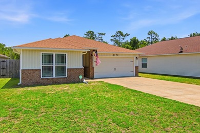 Located in the Duncan Ridge community of Navarre, this 3-bedroom - photo 5