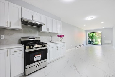 Welcome to this fully renovated 2-Family Condo Townhouse located - photo 8