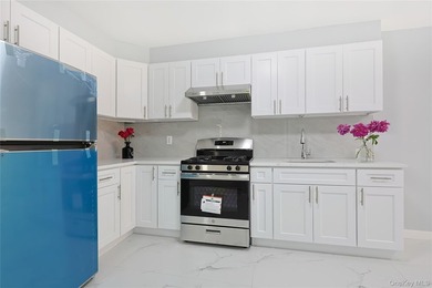 Welcome to this fully renovated 2-Family Condo Townhouse located - photo 10