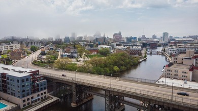 River and skyline views set the tone from your private balcony - photo 25