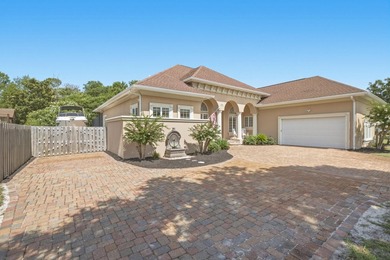 Nestled within the gated community of Soundside Shores, this - photo 2