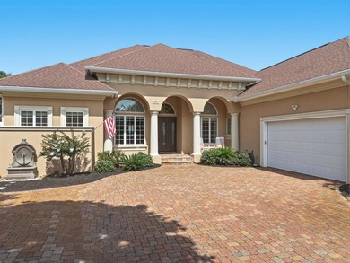 Nestled within the gated community of Soundside Shores, this - photo 3