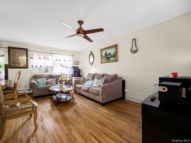 This three-story brick two-family home in Cypress Hills features - photo 2