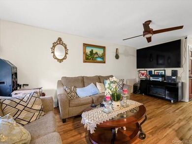 This three-story brick two-family home in Cypress Hills features - photo 3