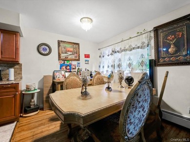 This three-story brick two-family home in Cypress Hills features - photo 4