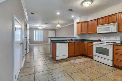 As you step inside you'll find tile floors flowing through the - photo 9