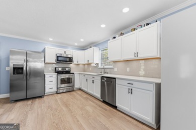 Beautifully remodeled and move-in ready, this 3-bedroom, 2-bath - photo 4