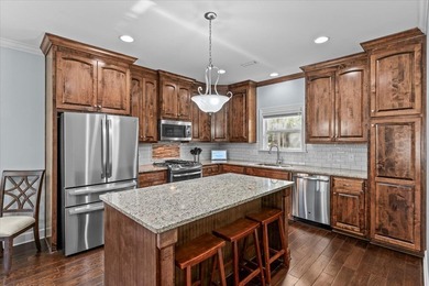 Tucked inside the Village of Highlands South, this 4-bedroom