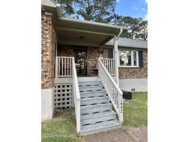 This charming brick bungalow in the harbor town of Belhaven - photo 3