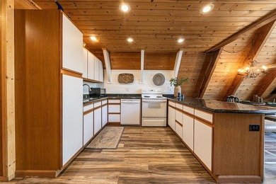 Welcome to 15685 Pine Street, a charming vintage A-frame nestled - photo 15