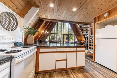 Welcome to 15685 Pine Street, a charming vintage A-frame nestled - photo 17