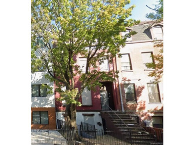 This four-story all-brick brownstone is full of potential and - photo 2