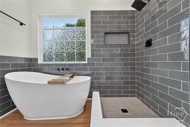 This completely renovated, turn-key four-bedroom, two-bathroom - photo 25
