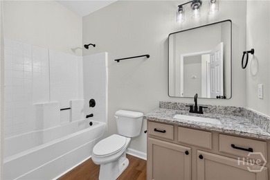 This completely renovated, turn-key four-bedroom, two-bathroom - photo 31