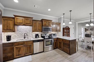 Discover low-maintenance living at its finest in this - photo 2