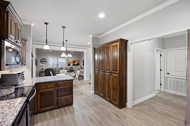 Discover low-maintenance living at its finest in this - photo 3