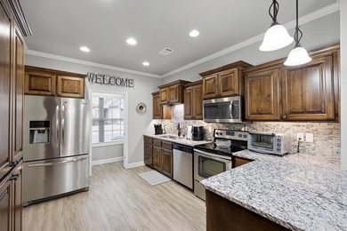 Discover low-maintenance living at its finest in this - photo 4
