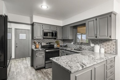 Stunning 1.5-story home in the highly desirable College Hill